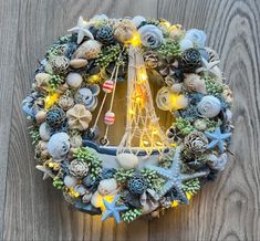 the eiffel tower is surrounded by sea shells and succulents with lights