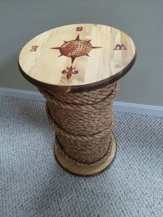 a spool of rope wrapped around a wooden table