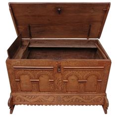 an old wooden chest with carvings on it