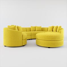 a large yellow sectional couch with pillows on the top and bottom, in front of a white background