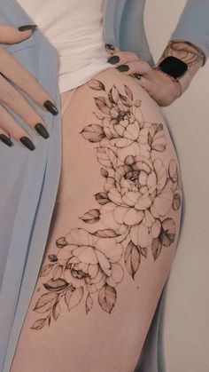 a woman's thigh with flowers on it