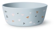 a blue bowl with brown and white triangles painted on the side, sitting in front of a white background