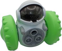 a green and white toy with an astronaut's helmet on it