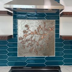 a stove top oven sitting inside of a kitchen next to a blue tile backsplash