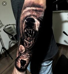 a man's arm with a bear tattoo on it, and an open mouth