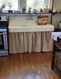 a kitchen with an old fashioned stove and sink