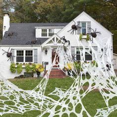 a house decorated for halloween with spider webs