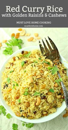 red curry rice with golden raisins and cashews in a white bowl