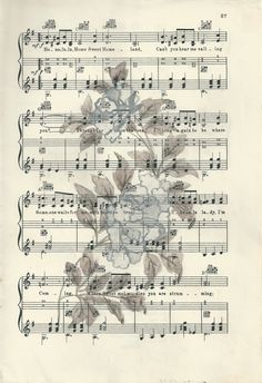 an old sheet music with flowers on it