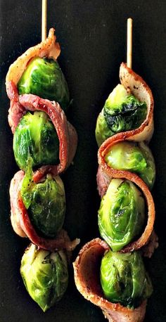 bacon and brussel sprouts on skewers with bacon wrapped around them