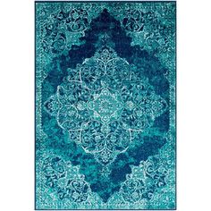 a blue area rug with an intricate design on the front and back side, in various colors