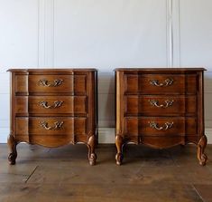 two wooden dressers sitting next to each other