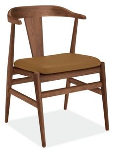 a wooden chair with a brown seat and back cushion on an isolated white background,