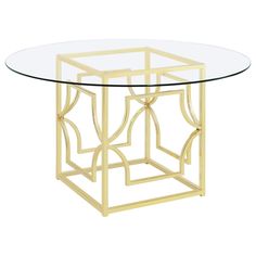 a round glass table with gold metal frame and an intricate design on the top, against a white background