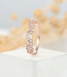 a diamond ring sitting on top of a white box