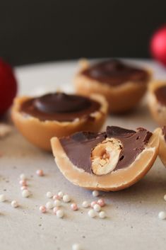 several pieces of chocolate covered pastries on a plate