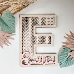 the letters e and f are made out of wood with paper fans on top of it