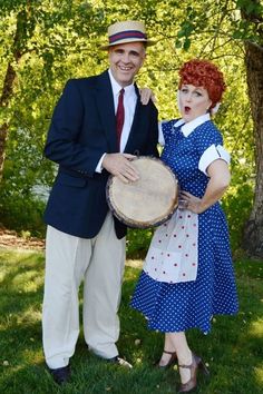 the man and woman are dressed up in costumes