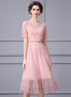 Jubilation meets sophistication in this stunning mother of the bride dress! It is a masterpiece that combines the soft allure of pink with the sophistication of lace and fine detailing. The scalloped V-neck and embroidered bodice offer a flattering fit, while the delicate beading at the waist adds just the right touch of glamour. This knee-length dress flares gently, promising ease of movement and a silhouette that suits every figure. The sheer sleeves offer coverage yet allow for a playful hint of skin, ensuring you look as youthful and spirited as you feel. It's a dress that's not just worn, but lived in, as it tells a story of love, celebration, and family legacy. Feminine V-neck Delicate Lace Dress, Lace V-neck Dress For Mother Of The Bride, Spring V-neck Lace Dress For Wedding Guest, V-neck Lace Dress For Wedding Guest In Spring, Spring Wedding Guest V-neck Lace Dress, Spring Lace Dress For Mother Of The Bride, V-neck Lace Dress For Wedding Guest, Spring Mother Of The Bride Lace Dress, Spring Feminine Mother Of The Bride Dress