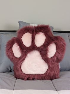 a pillow that has a paw print on it