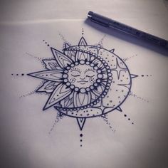 a drawing of a sun with a face on it's side, next to a pen