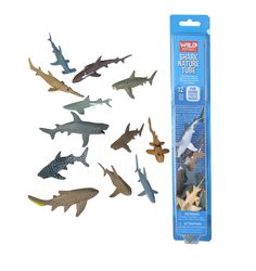 an assortment of plastic shark toys in a package