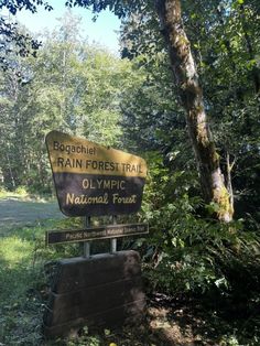 a sign for the olympic national forest