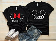 two shirts that say mommy and baby with minnie mouse ears on the front, one has a red bow