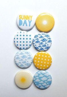 six buttons with the words sunny day written on them in different colors and shapes,