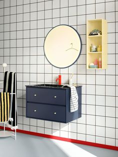 a bathroom with a sink, mirror and towel rack on the wall next to it