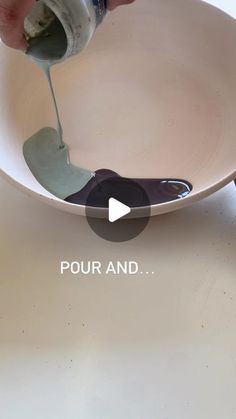 a person pouring something into a bowl with the words pour and below it, on a table