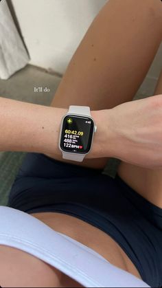 a woman wearing an apple watch on her arm