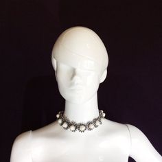 This Coachella-inspired, formal white pearl silver choker necklace is made of big egg-shaped, white cultured pearls and silver fire flash polished crystals. It is fastened in the back w/ non-fade aluminum clasps. To ride the hot choker jewelry trend this 2016, we created our own collection of artisanal, handmade bohemian choker necklaces executed using intricate hand beadwork techniques.This bombshell chunky white pearl choker is both trendy and elegant. It's a versatile piece that can be worn i White Metal Pearl Choker Necklace, White Pearl Charm Choker Jewelry, White Pearl Drop Choker Jewelry, White Metal Choker For Party, White Round Pearl Necklace, White Pearl Choker Jewelry, White Pearl Charm Choker For Party, White Pearl Embellished Choker Jewelry, White Pearl Embellished Choker