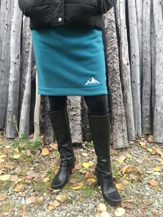 "Short and simple.  This skirt features double layered anti-pill polar fleece, knee length, elastic waist, and an embroidery design. It is meant to wear over your normal clothing for those extra chilly days.  You could also wear it over your favorite tights or leggings with winter boots, your healed knee highs, or a chunky pair of buckle boots!  Wear it to the gym over your workout gear!  This is a nice alternative to snow pants or long parkas in cold climates.  You can stay warm and look good doing it in style!   Note: If you have any questions about colors or prints, I can send you a picture of what I have. Just contact me before you place your order and I'll get those pictures to you. Note: These are made-to-order custom skirts, so the more information I have the better.  Please include Fleece Skirt, Long Parka, Normal Clothes, High Knees, Buckle Boots, Snow Pants, Polar Fleece, Workout Gear, Winter Boots