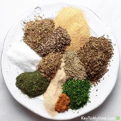 a white plate topped with different types of spices