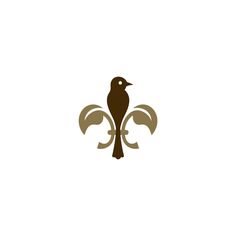 a bird sitting on top of a fleur de lis symbol