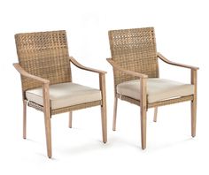 two wicker chairs sitting next to each other