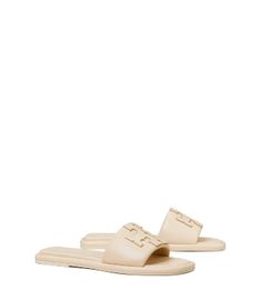 Directly from Tory Burch - Chic comfort. The sport slide is made of soft padded leather that hugs the foot, with a cushioned foam insole for flexible support. The raised Double T is edged in metallic trim for subtle shine. Tory Burch Official Site. Miller Sandal, Square Toe Sandals, Leather Thong Sandals, Dresses Designer, Footwear Design Women, Designer Sandals, The Double, Perfect Shoes, Tory Burch Shoes