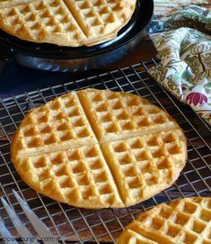 three waffles cooling on a wire rack