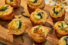 there are many small pastries on the cutting board