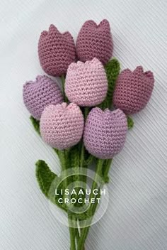 crocheted pink and purple flowers with leaves