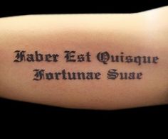 a person with a tattoo on their arm that reads, saber eat quisage fortunae sure