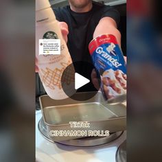 a man is pouring cinnamon rolls into a baking pan with a can of coffee in it