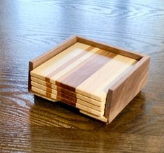 a wooden tray sitting on top of a wooden table