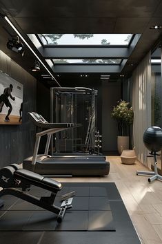 a gym with treadmills, exercise equipment and yoga mat