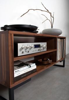 a record player is sitting on top of a shelf