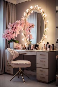 a vanity with flowers and candles on it in front of a round mirror that is lit up