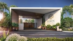 the entrance to eden villa is surrounded by greenery