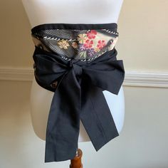 Vintage Obi Sash Waist Belt...Features a beautiful Floral Japanese print in Black in combination with pastels & colorful flowers... It is reversible with the other side solid Black...Can be worn on a dress, a kimono, a jumpsuit, a tunic, a long shirt ... Measurements:  - 102 inches end to end  - Widest center 7 inches Excellent condition My items are mostly vintage, and with vintage comes a previous life. I examine items carefully, but minor wear and tear are to be expected. I will note anything I find beyond minor. I try to show condition as well through photos, so please look carefully. I'm happy to answer questions. Wrap Belt, Wedding Sash Belt, Wedding Belts, Pastel Floral, Japanese Fabric, Long Shirt, Japanese Prints, Waist Belt, Solid Black