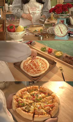 two pizzas are being served on trays in front of a woman with an apron